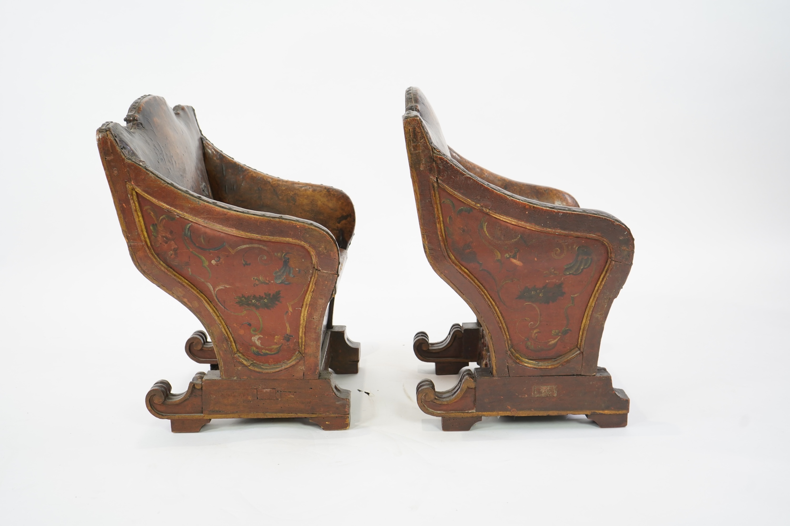 A pair of 19th century Venetian carved wood and tan leather Gondola seats